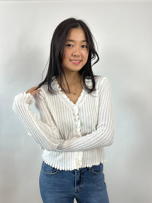 Ribbstickad tröja med knappar